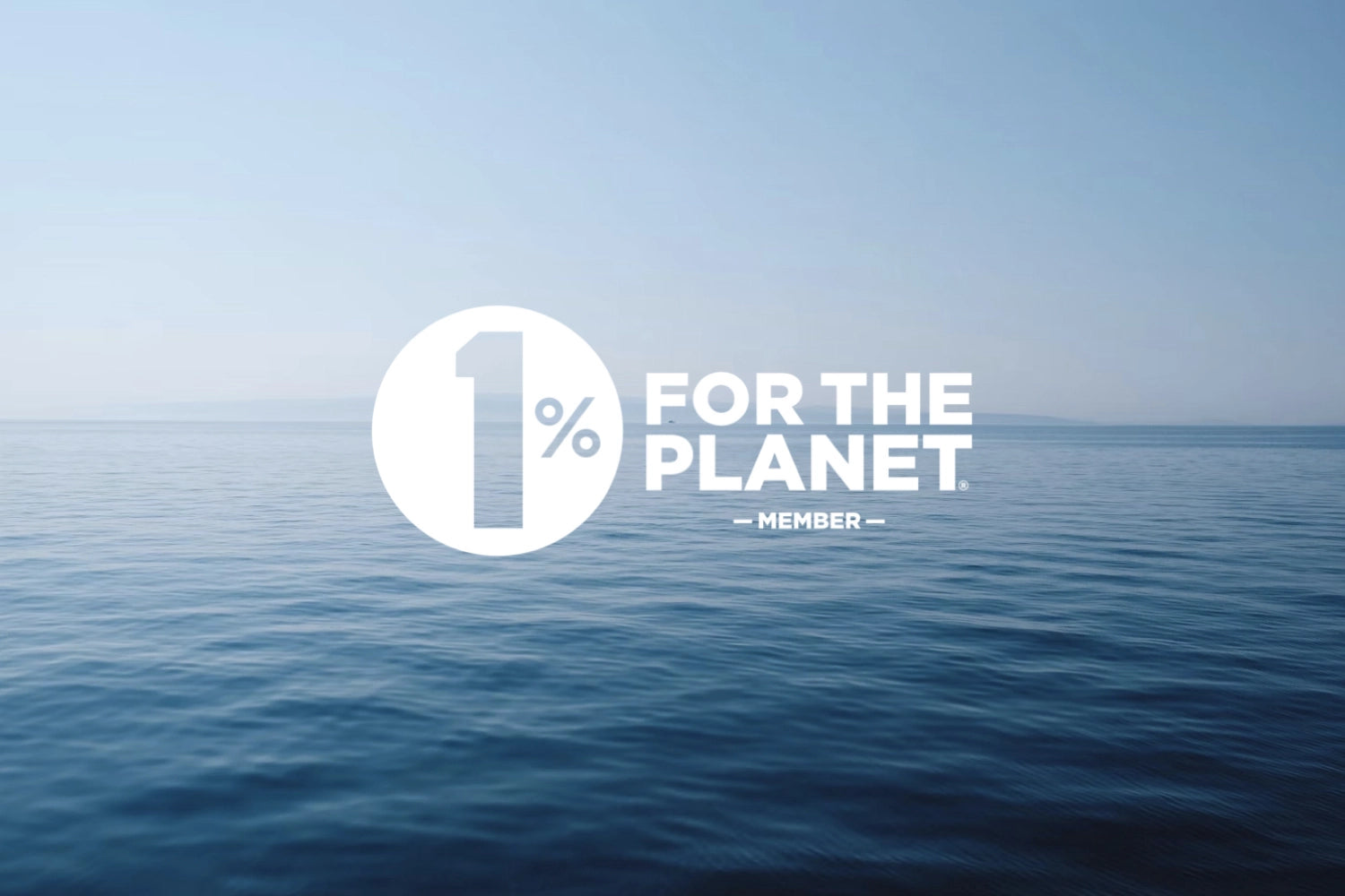 1% for the planet member 字樣壓印在粼光浮現的平靜海面上
